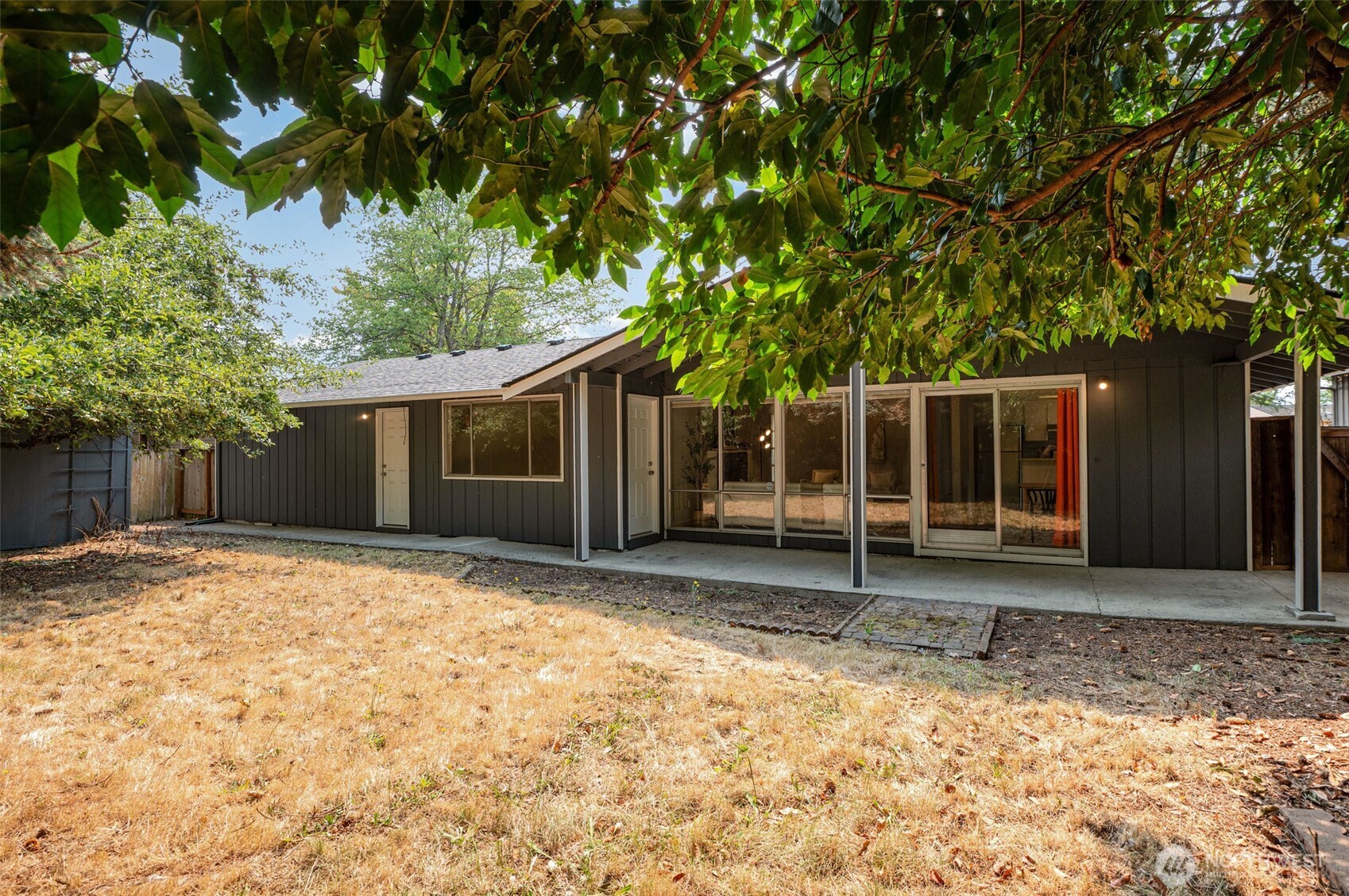 11804 Southeast 165th Street Renton, WA 98058 - Photo 24 of 28 a house with trees in the background
