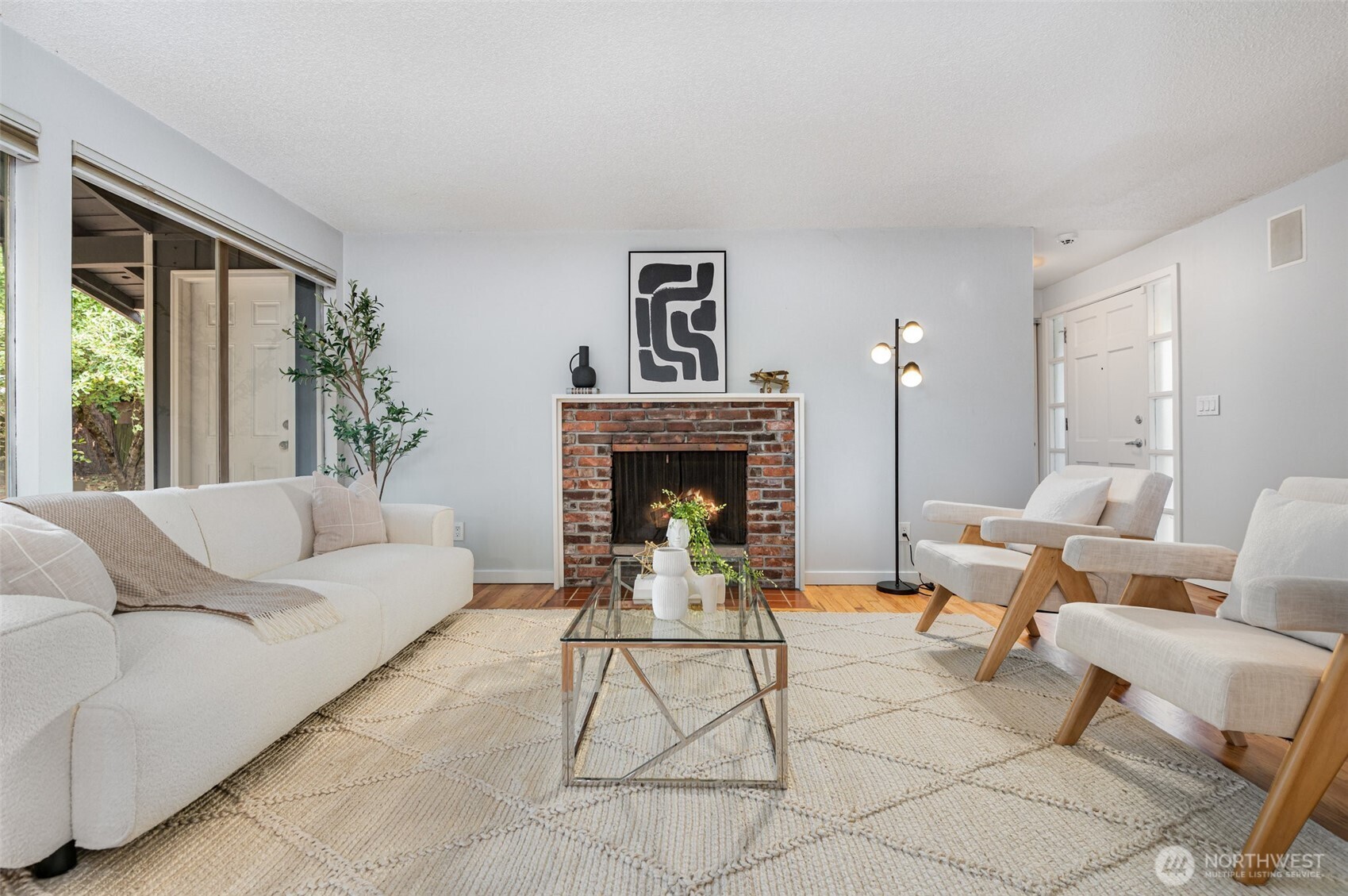 11804 Southeast 165th Street Renton, WA 98058 - Photo 6 of 28 a living room with furniture two window and a fireplace
