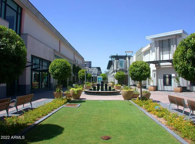 a view of a house with backyard porch and sitting area
