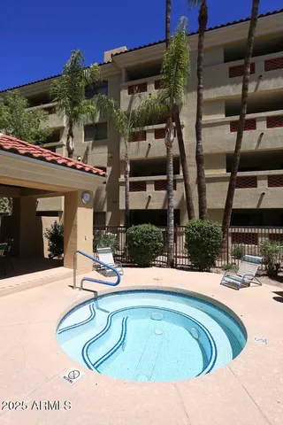 a swimming pool with outdoor seating and yard