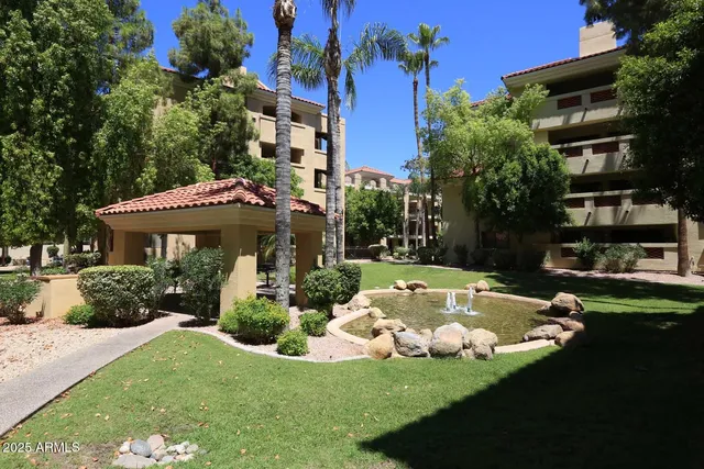 a view of a house with swimming pool and a garden