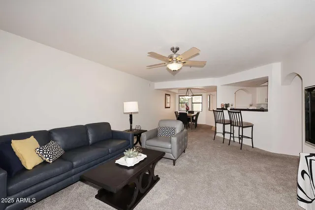 a living room with furniture and a table