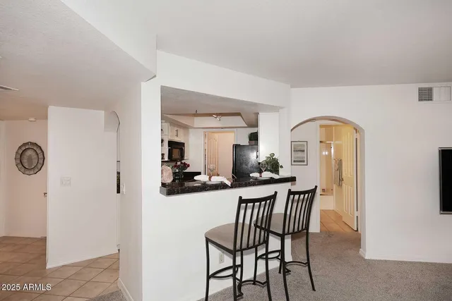 a view of a livingroom with furniture and entryway