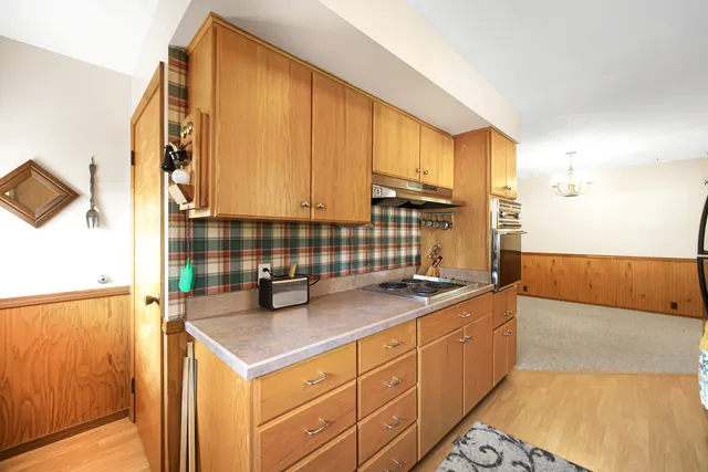 a kitchen with stainless steel appliances granite countertop a sink and cabinets