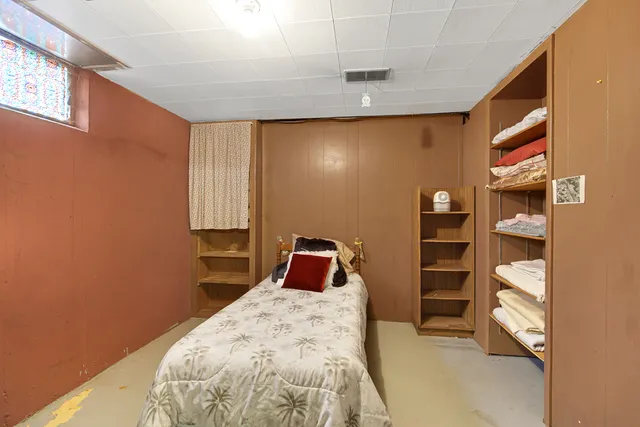 a room with a wooden floor and furniture