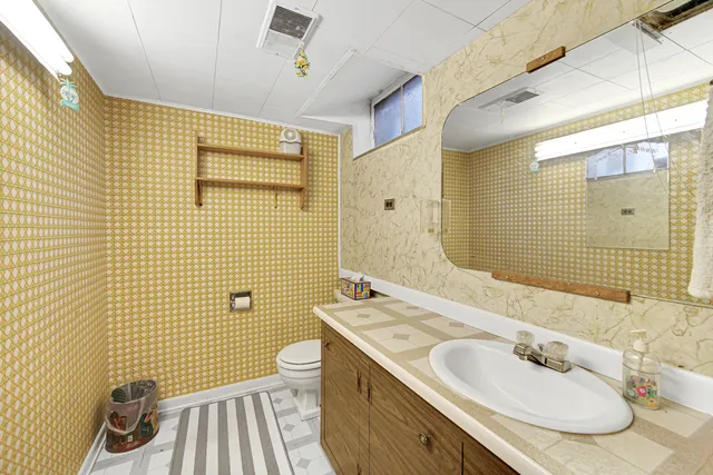 a view of a bedroom and bathroom