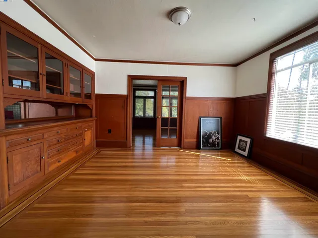 a room with lots of furniture and a wooden floor