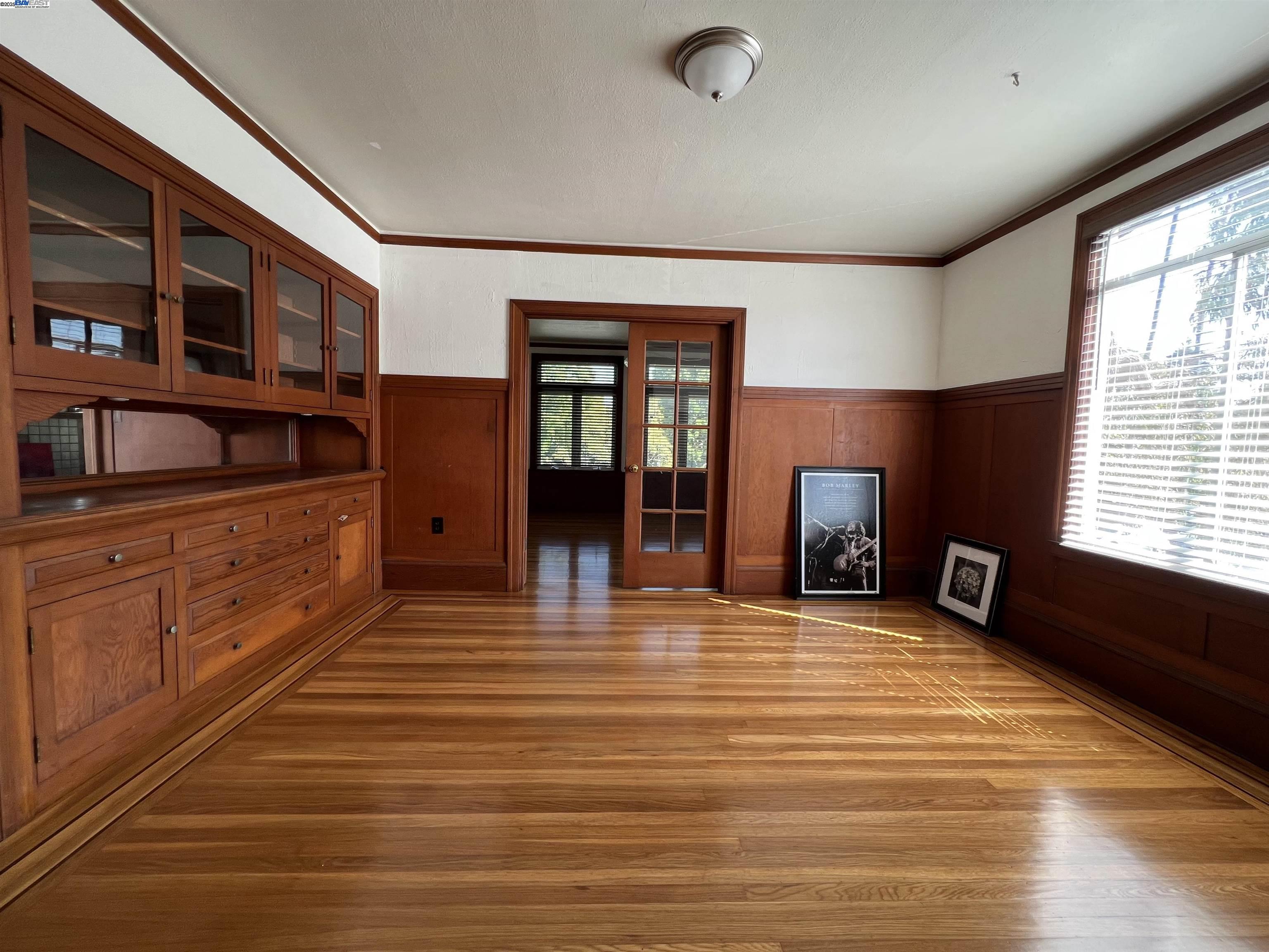1301 9th Street Alameda, CA 94501 - Photo 5 of 12 a room with lots of furniture and a wooden floor