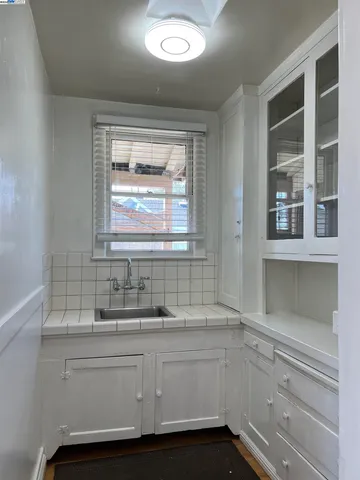 a bathroom with a sink and a window