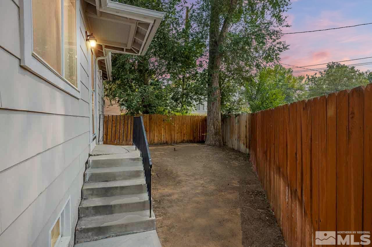 120 Caliente Street Reno, NV 89509 - Photo 20 of 20 a view of a house with backyard and wooden fence