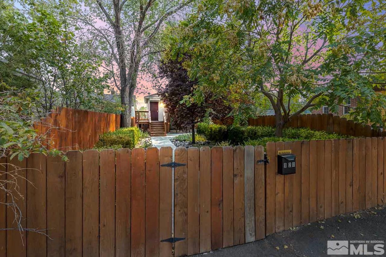 120 Caliente Street Reno, NV 89509 - Photo 2 of 20 a view of a wooden fence with a trees
