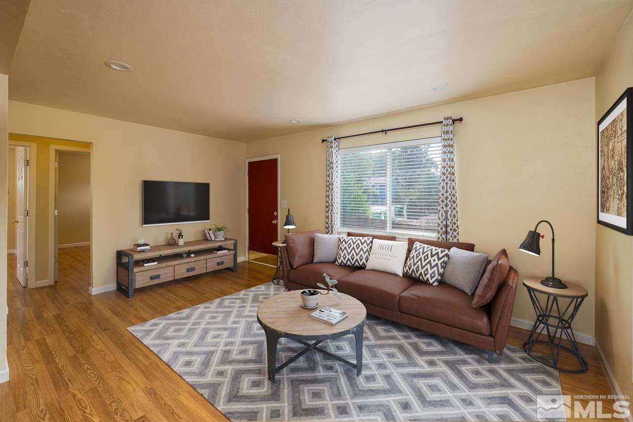 120 Caliente Street Reno, NV 89509 - Photo 5 of 20 a living room with furniture and a flat screen tv
