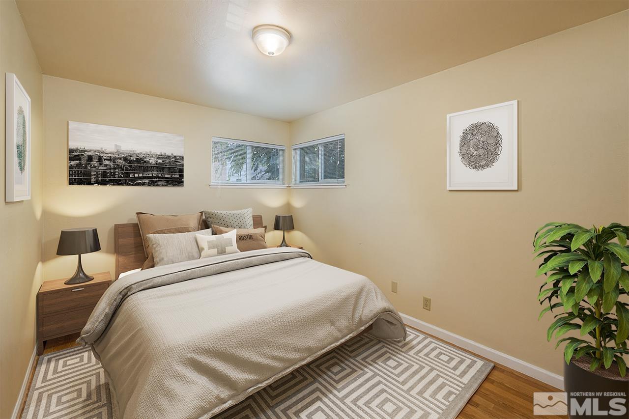 120 Caliente Street Reno, NV 89509 - Photo 8 of 20 a bedroom with bed and a potted plant