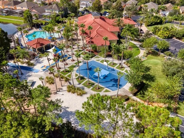 an aerial view of a house with a yard and garden