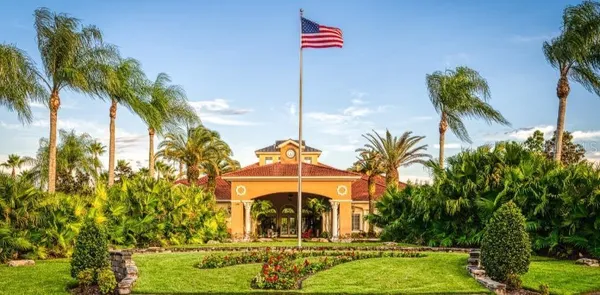 a bedroom with bed and a chandelier