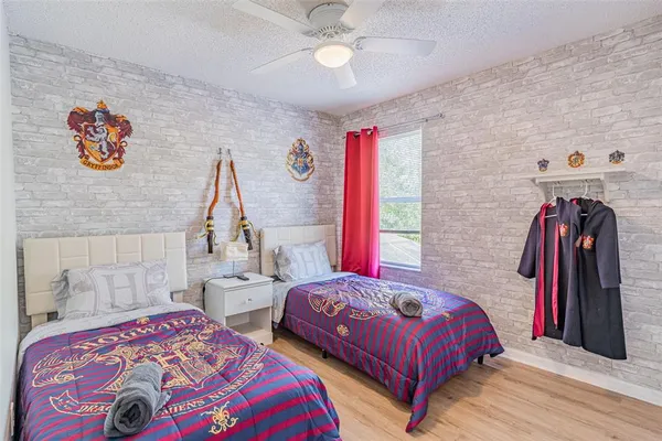 a bed room with a bed and a chair