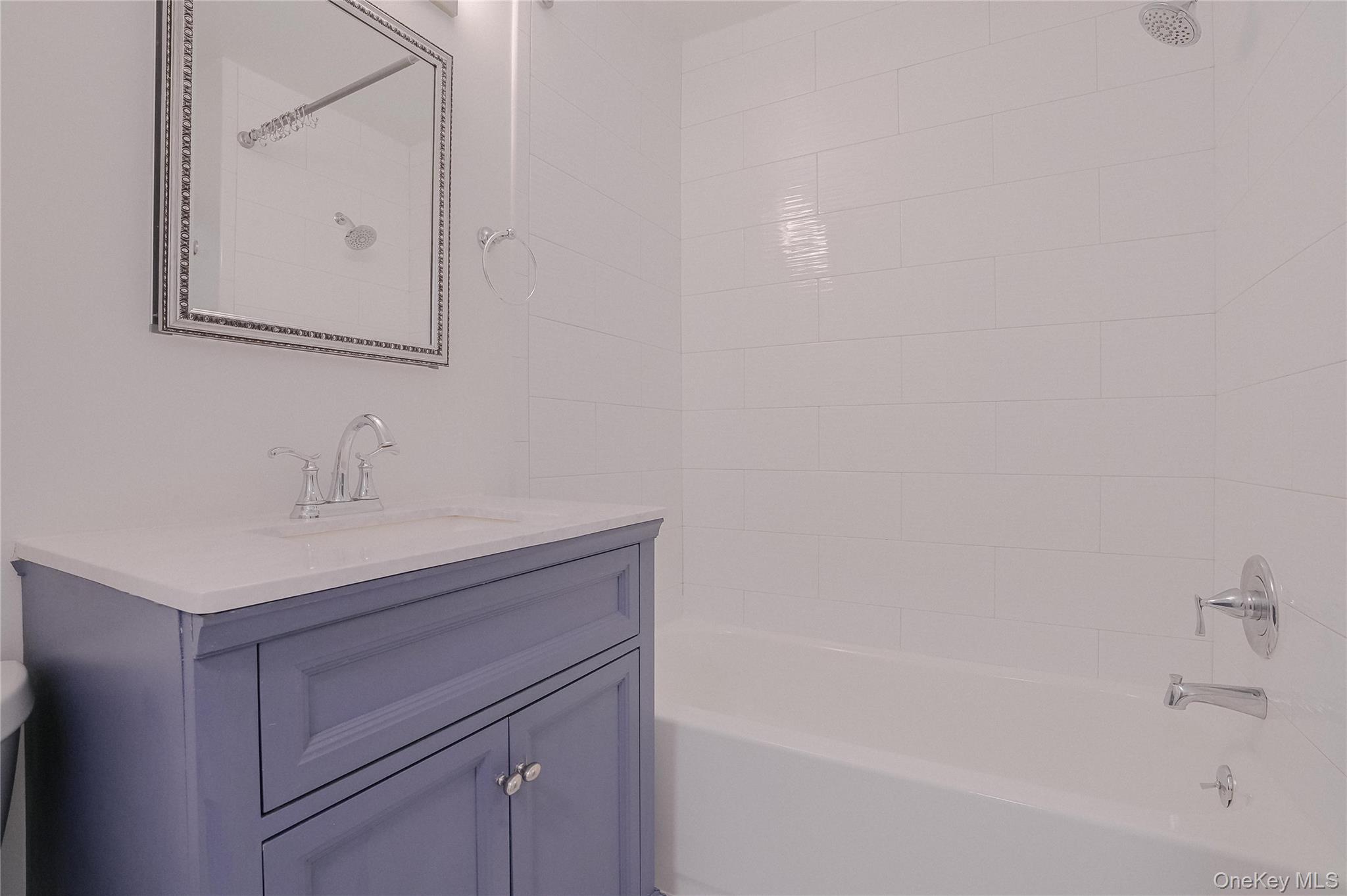203 Park Ridge Lane White Plains, NY 10603 - Photo 12 of 30 a bathroom with a sink a vanity and a mirror