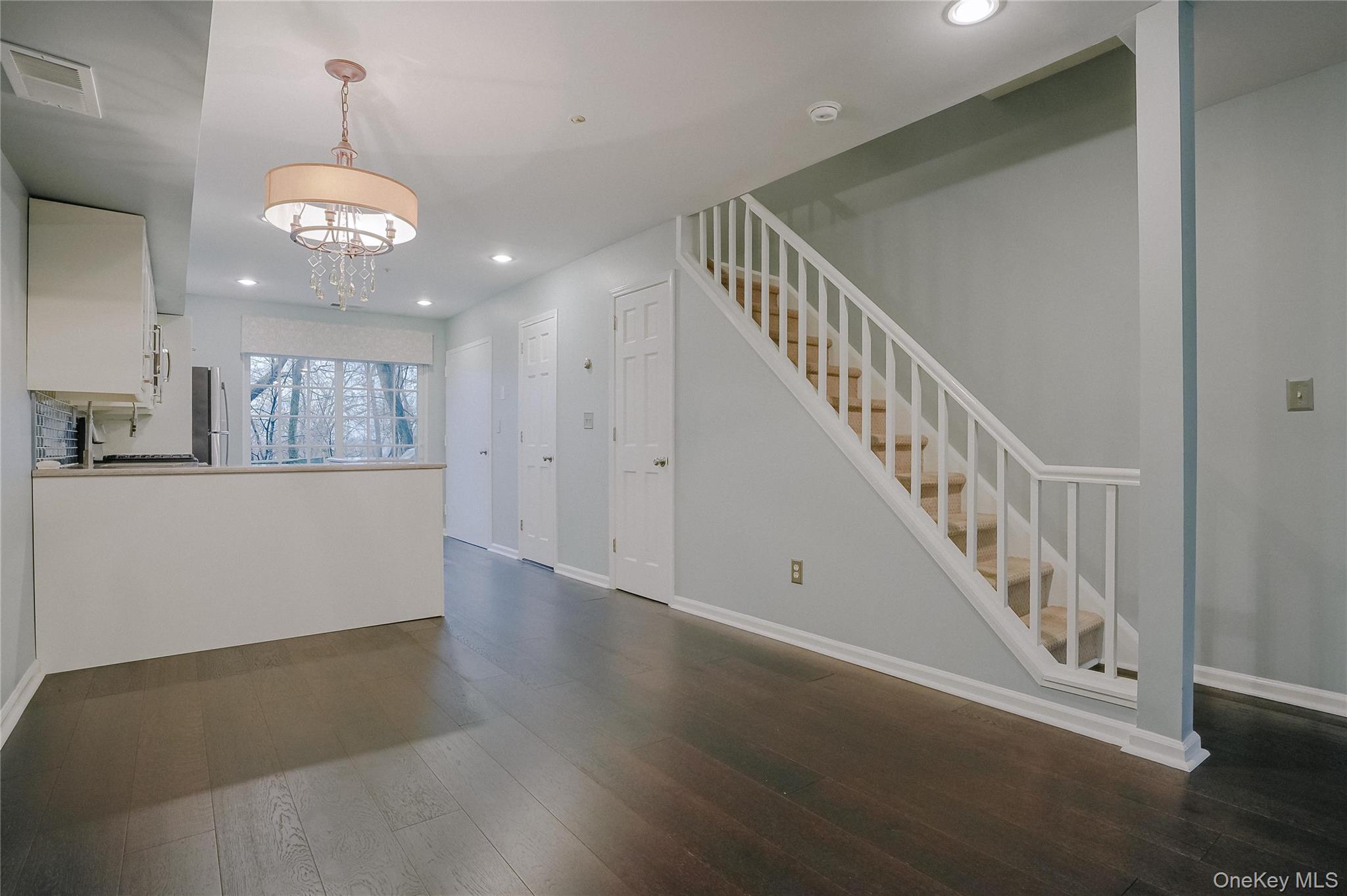 203 Park Ridge Lane White Plains, NY 10603 - Photo 19 of 30 a view of a hallway with wooden floor and staircase