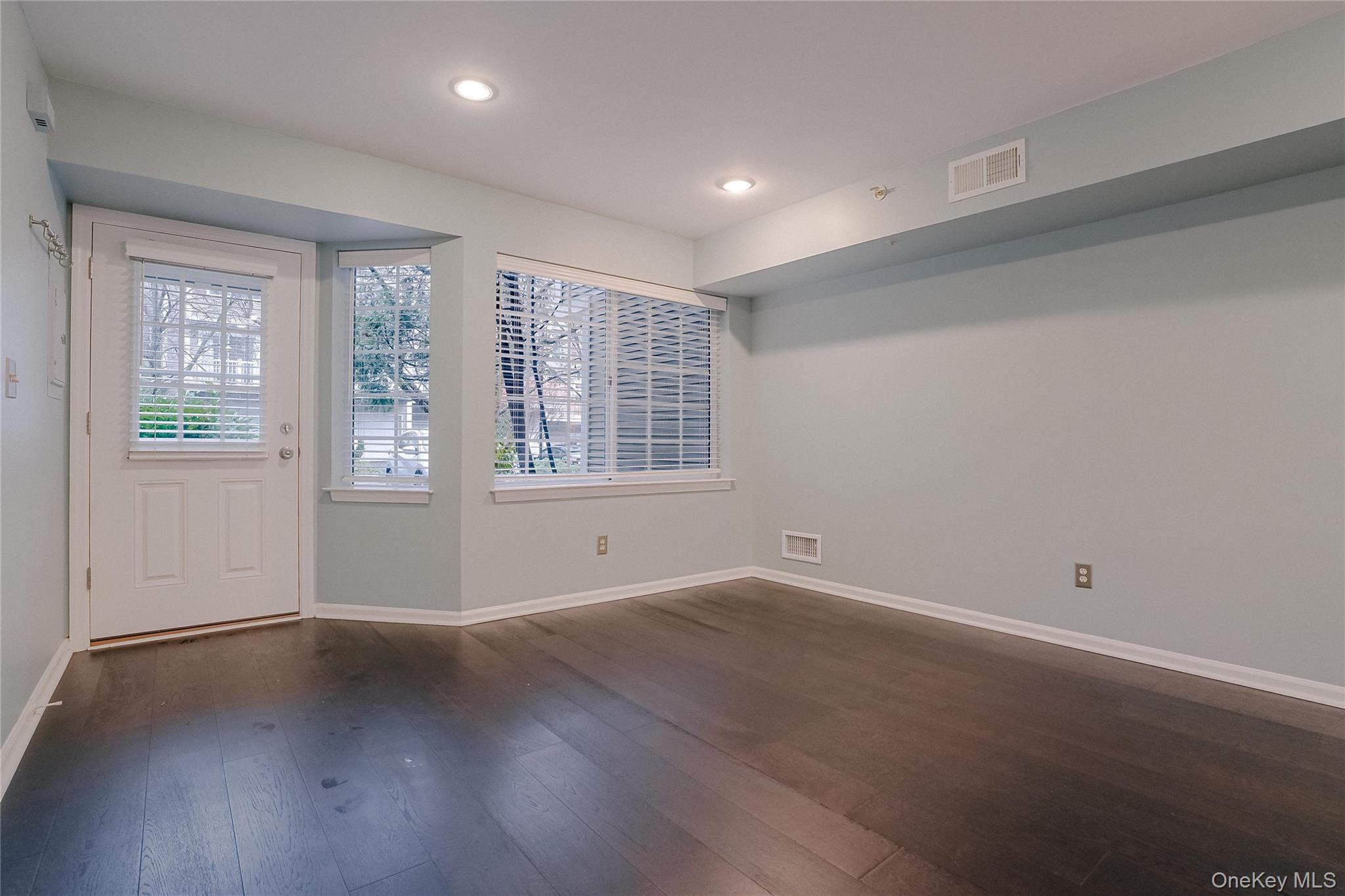 203 Park Ridge Lane White Plains, NY 10603 - Photo 24 of 30 a view of an empty room with wooden floor and a window