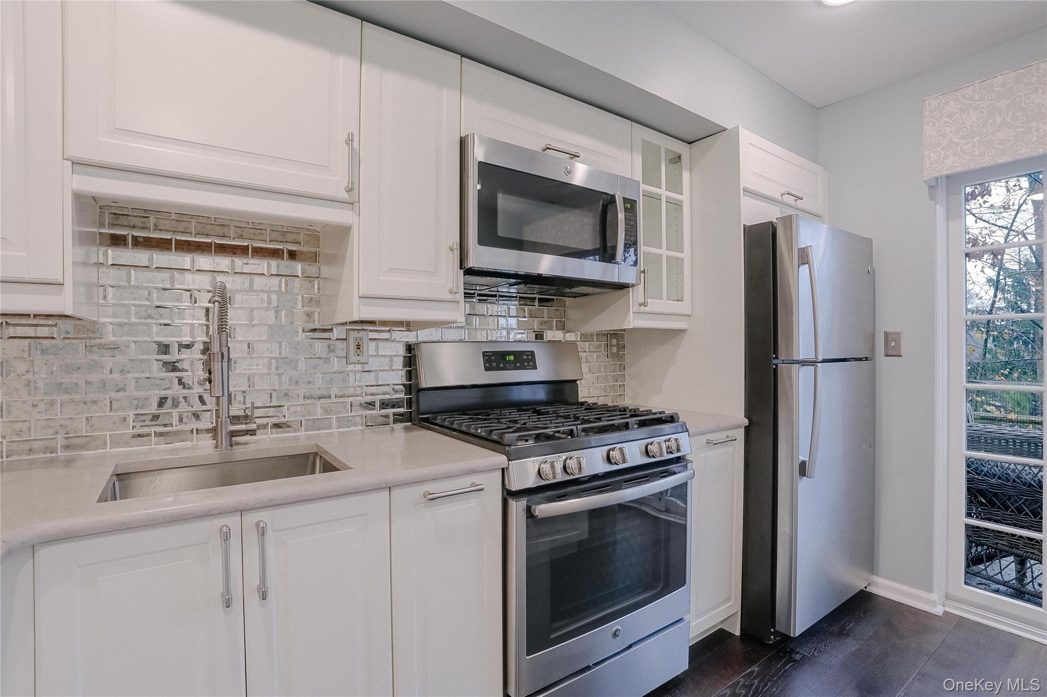203 Park Ridge Lane White Plains, NY 10603 - Photo 27 of 30 a kitchen with stainless steel appliances a stove a sink and a microwave