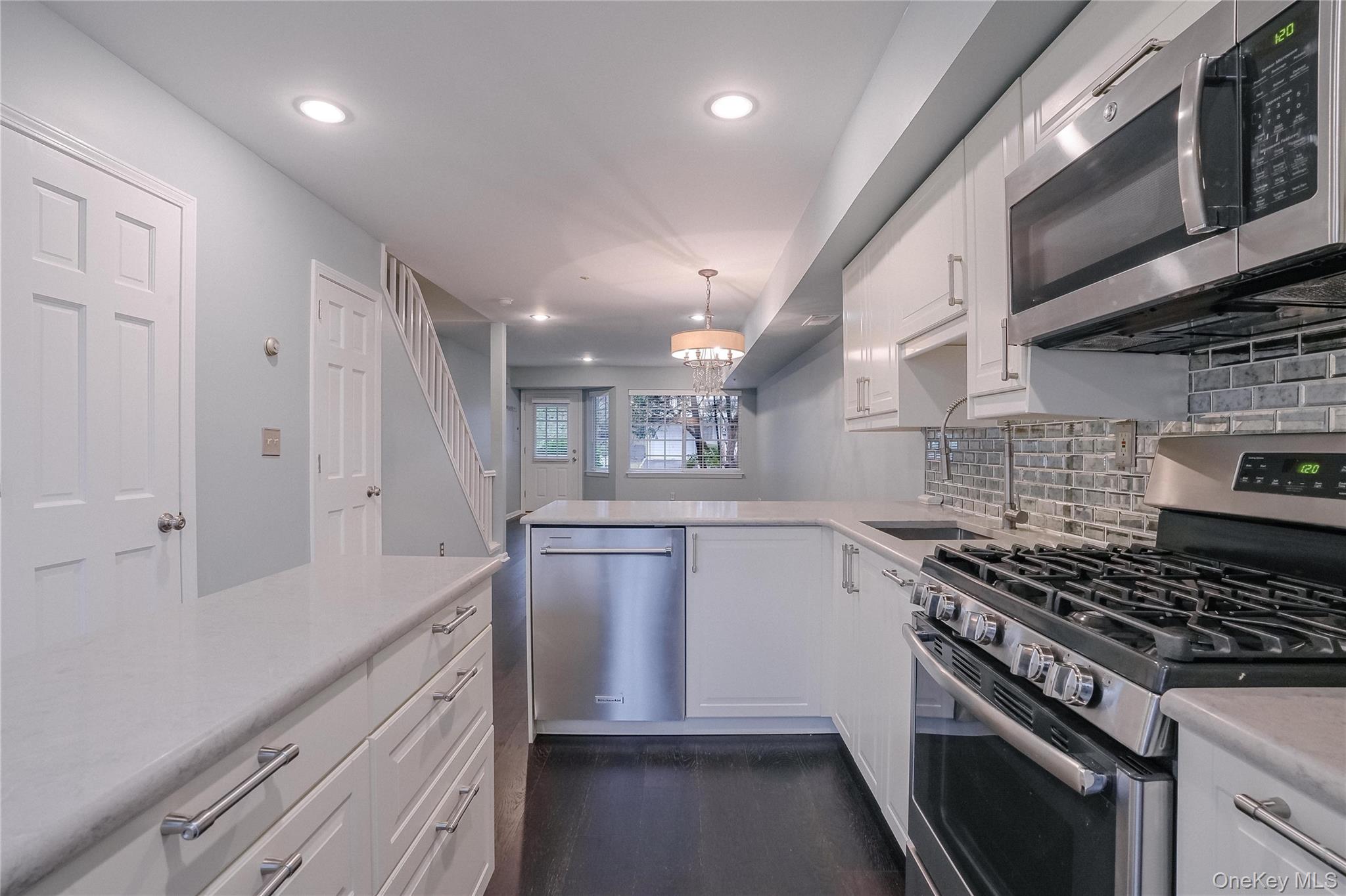 203 Park Ridge Lane White Plains, NY 10603 - Photo 29 of 30 a kitchen with granite countertop a sink stove and cabinets