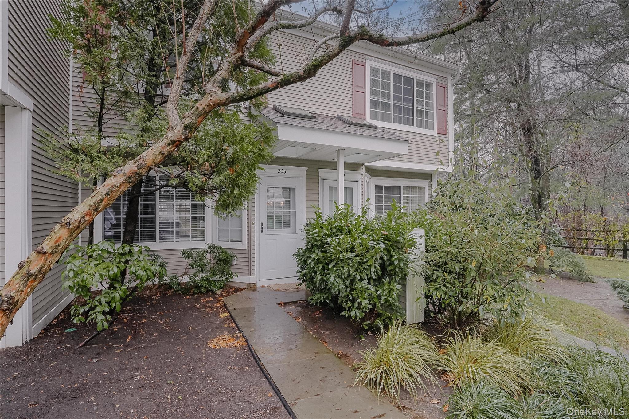 203 Park Ridge Lane White Plains, NY 10603 - Photo 3 of 30 a front view of a house with a garden