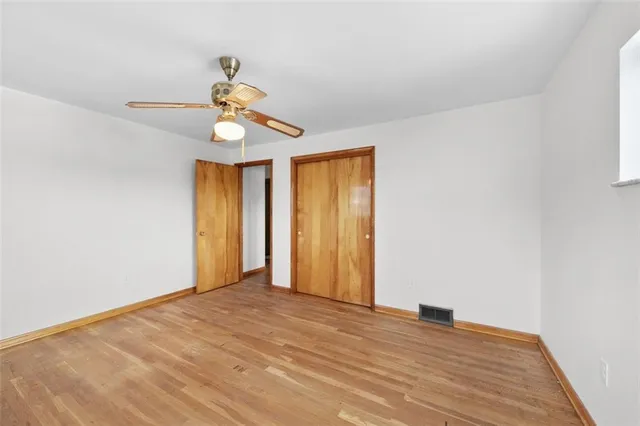 a view of entryway with stairs and wooden floor