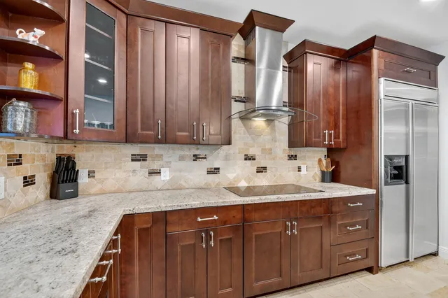 a spacious bathroom with a granite countertop tub sink shower and mirror
