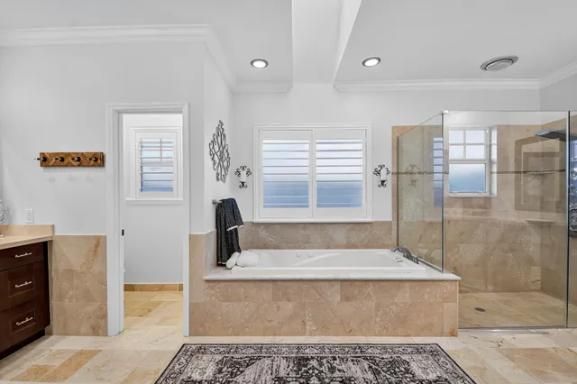 a view of walk in closet with clothes