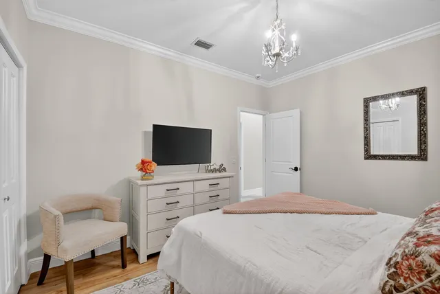 a backyard of a house with a yard and large trees