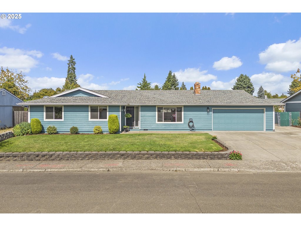 a front view of a house with a garden