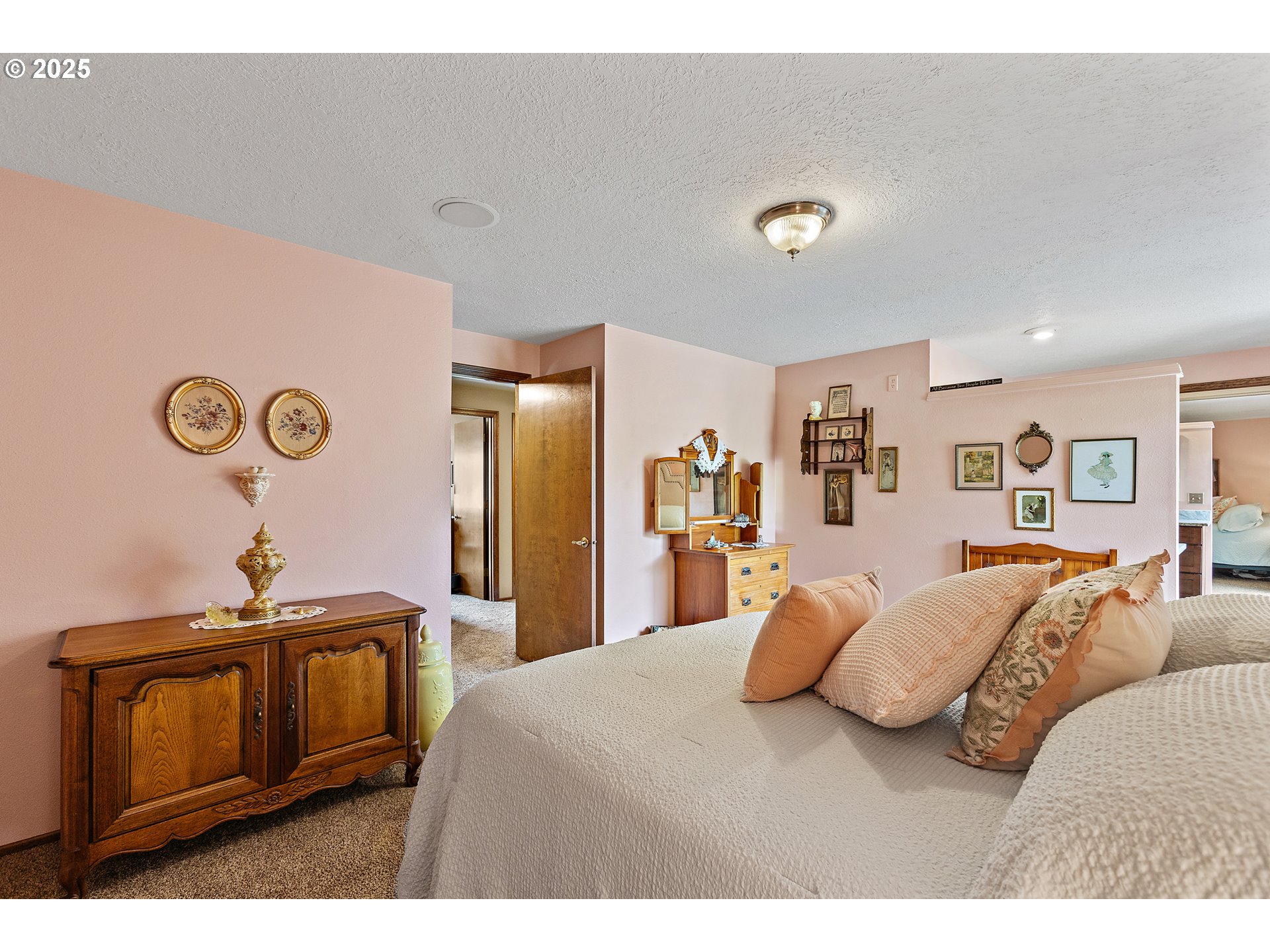 1754 Springtime Court Northeast Keizer, OR 97303 - Photo 15 of 35 a bedroom with a bed and cabinets