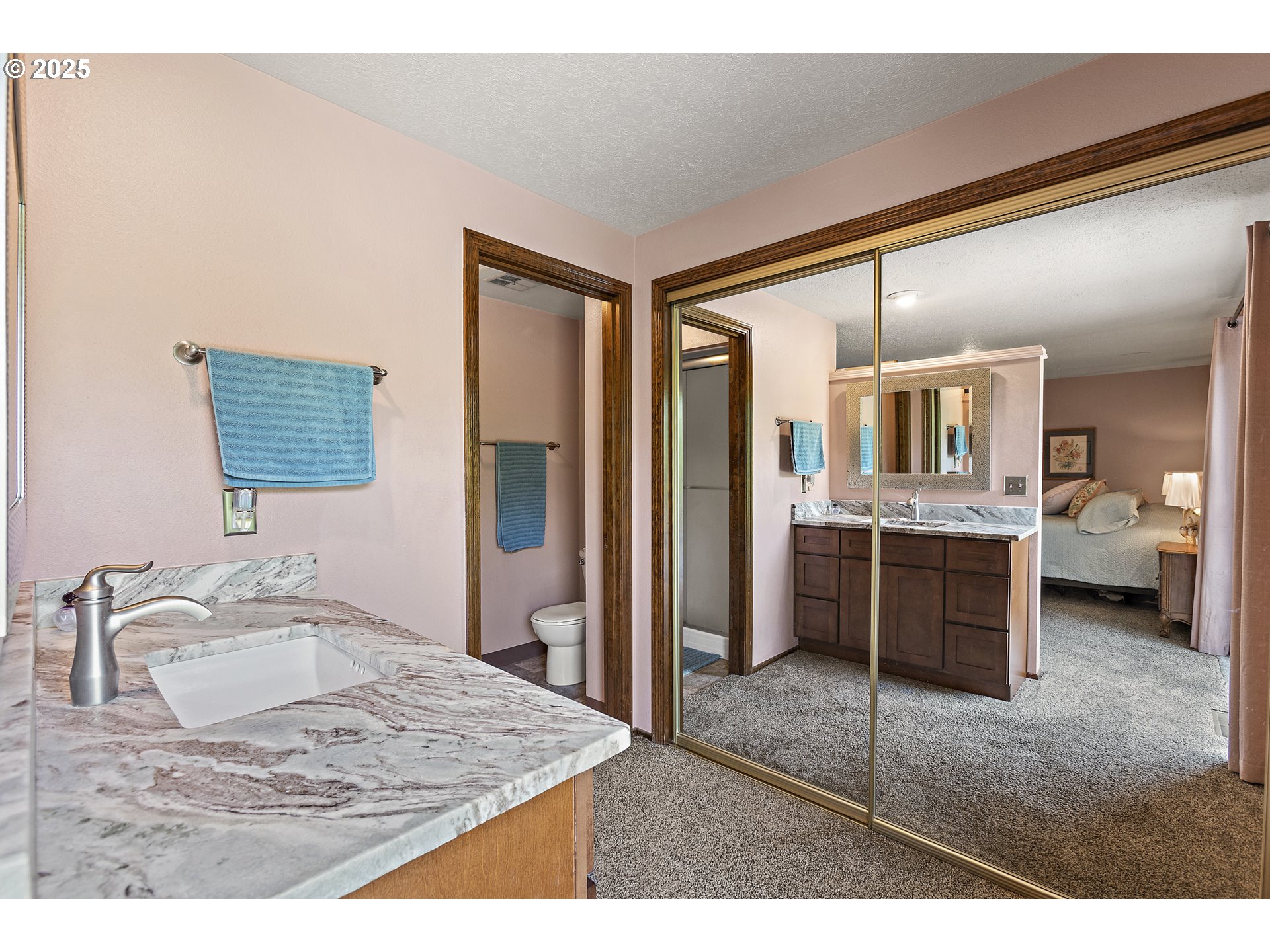 1754 Springtime Court Northeast Keizer, OR 97303 - Photo 16 of 35 a en suite bathroom with a granite countertop sink and a mirror