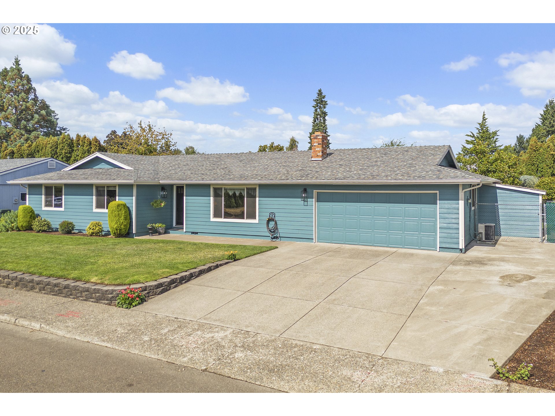 1754 Springtime Court Northeast Keizer, OR 97303 - Photo 2 of 35 a front view of a house with a garden
