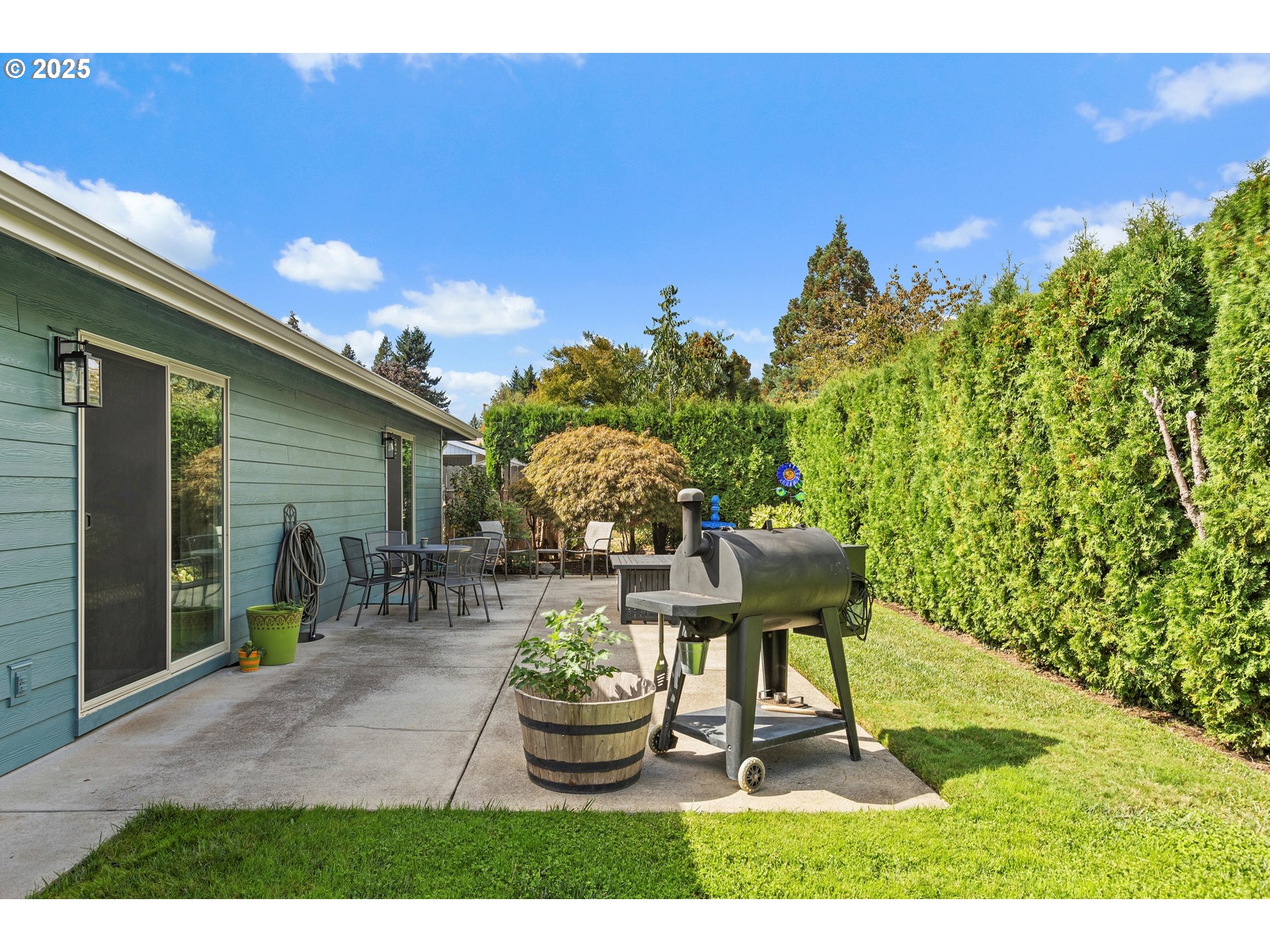 1754 Springtime Court Northeast Keizer, OR 97303 - Photo 23 of 35 a backyard of a house with table and chairs