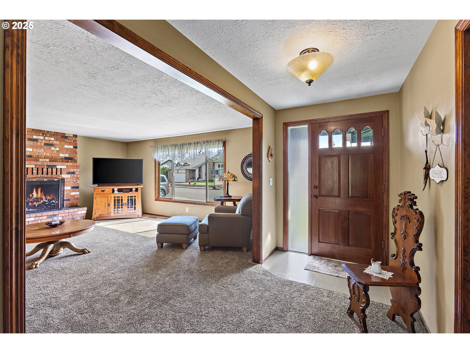 1754 Springtime Court Northeast Keizer, OR 97303 - Photo 4 of 35 a living room with furniture and a flat screen tv
