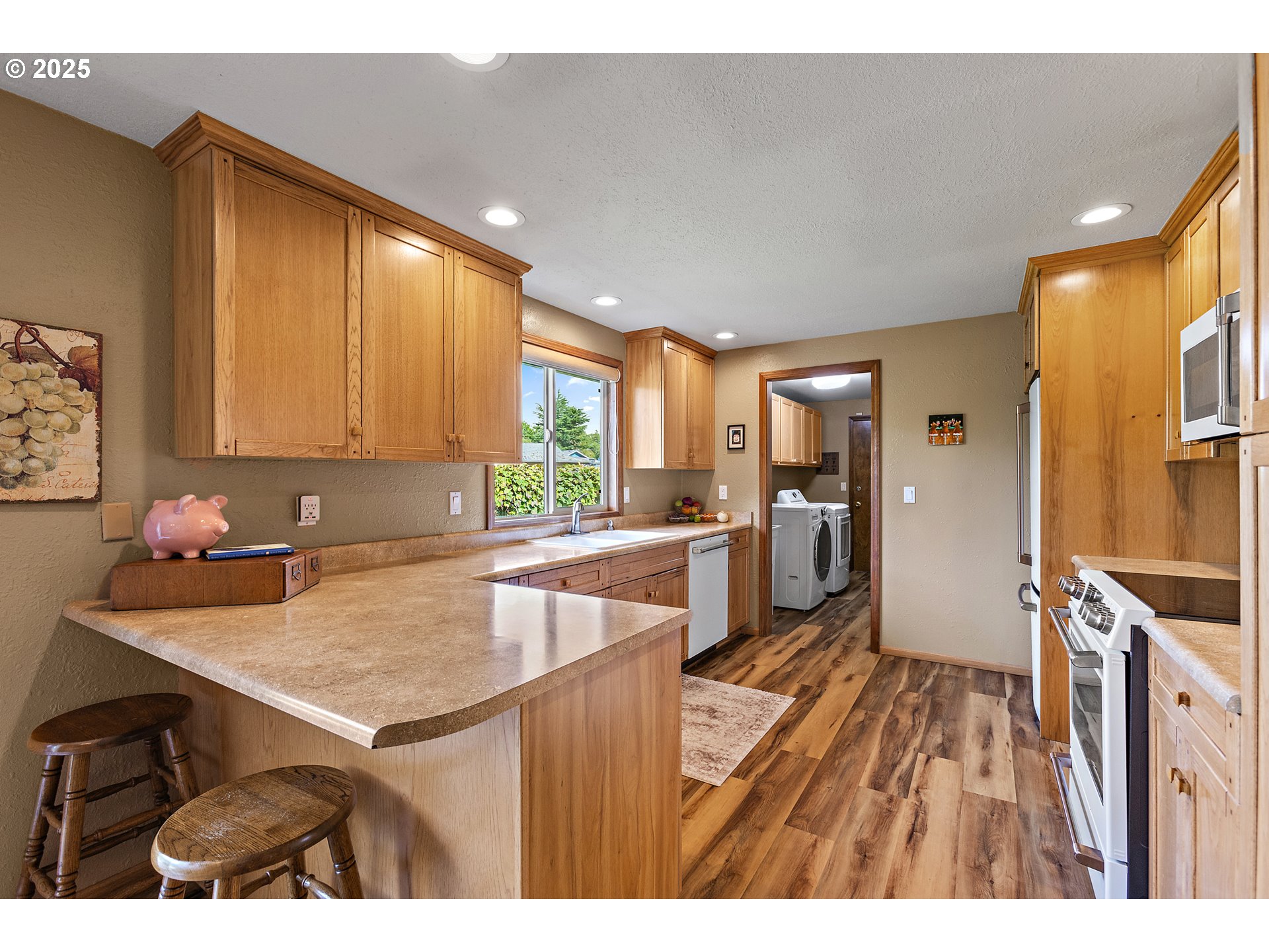 1754 Springtime Court Northeast Keizer, OR 97303 - Photo 10 of 35 a kitchen with a sink appliances cabinets and a counter top space