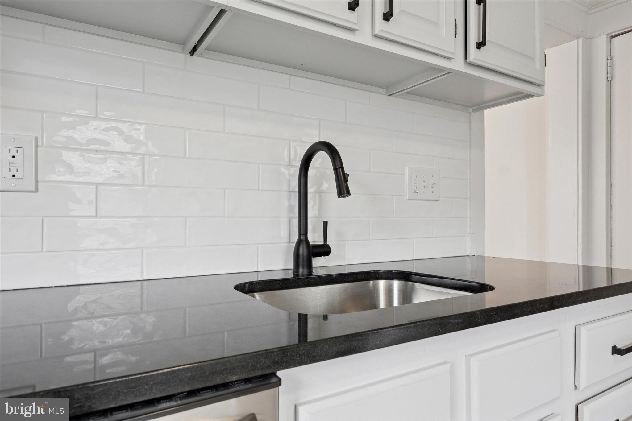 10 West Jefferson Street Media, PA 19063 - Photo 13 of 24 a close view of a sink a counter and a shower in a bathroom