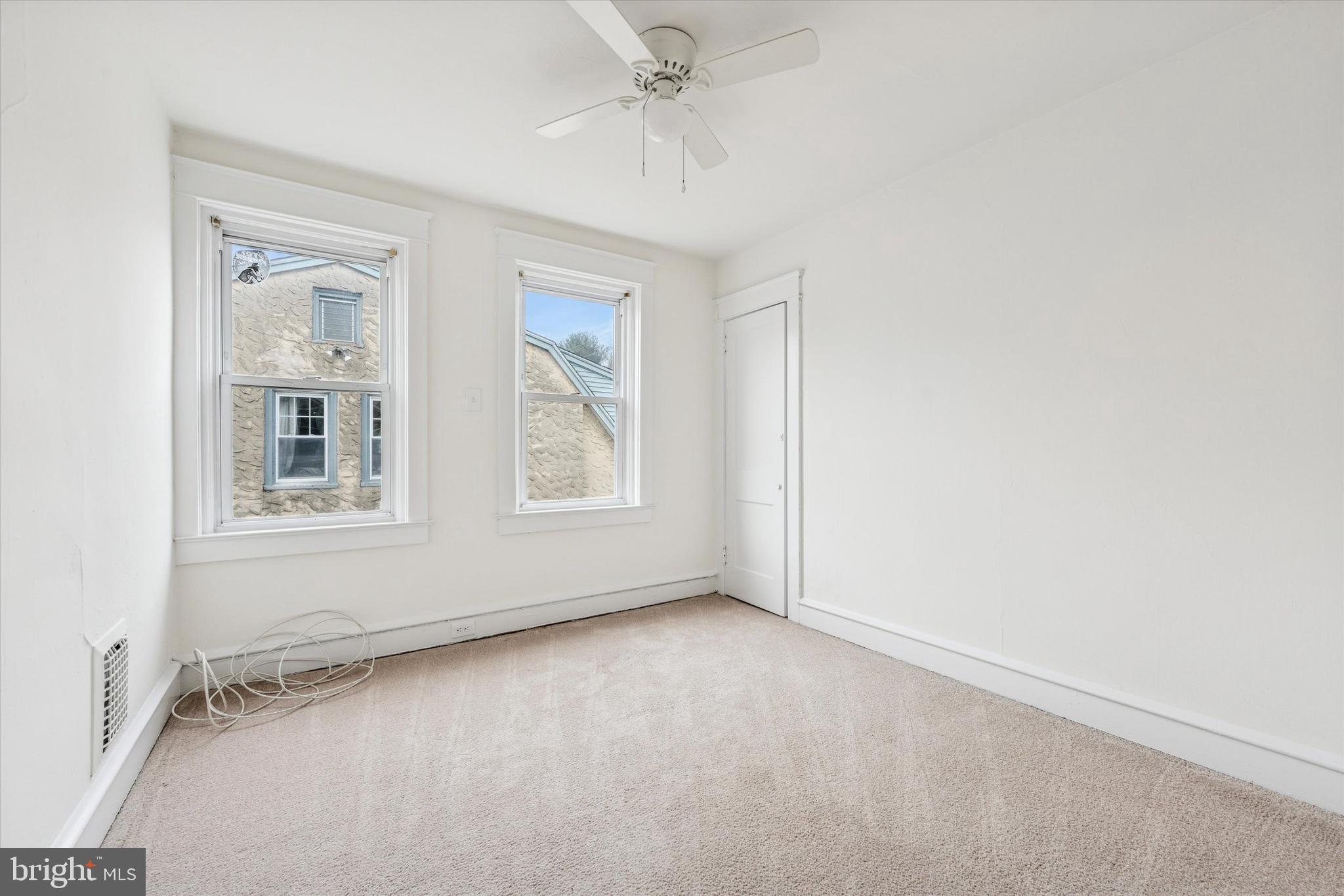 10 West Jefferson Street Media, PA 19063 - Photo 18 of 24 an empty room with a window and a ceiling fan