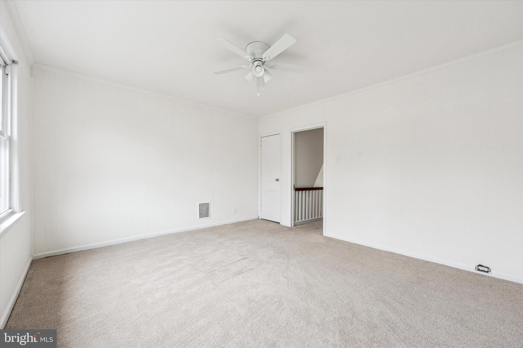 10 West Jefferson Street Media, PA 19063 - Photo 21 of 24 an empty room with a ceiling fan and a window