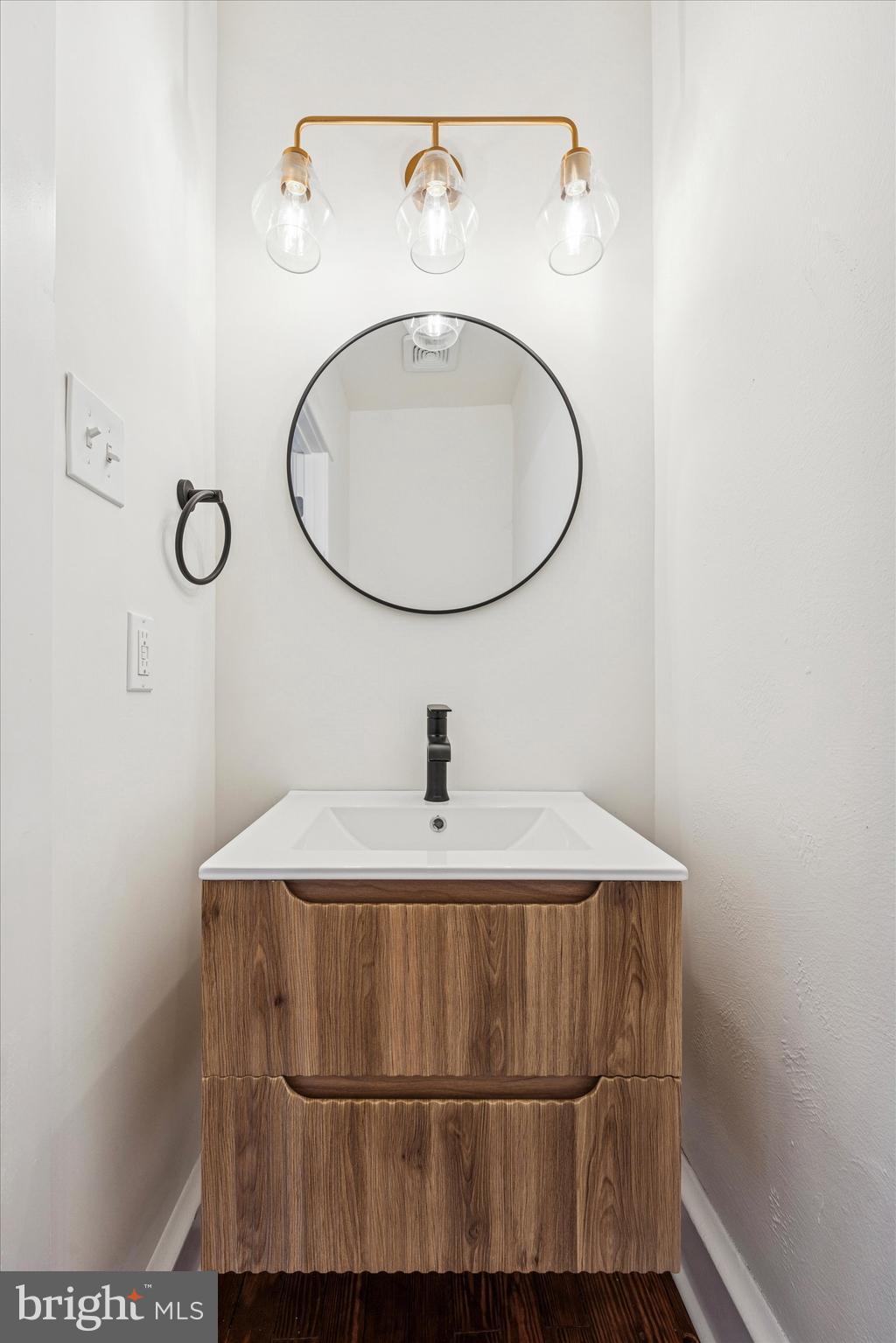 10 West Jefferson Street Media, PA 19063 - Photo 8 of 24 a bathroom with a sink and mirror