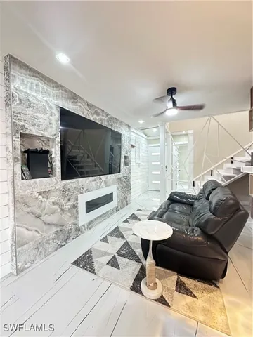 a living room with furniture and a flat screen tv