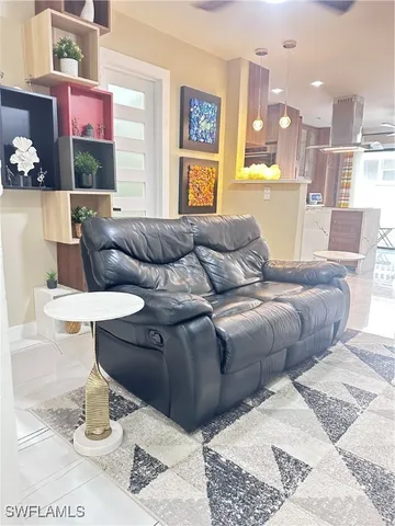 a living room with furniture and a table