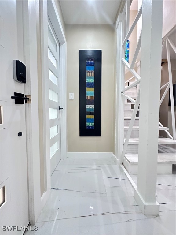 1107 1st Street South, Unit H Jacksonville Beach, FL 32250 - Photo 17 of 43 a view of an entryway with wooden floor and windows
