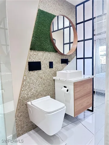a bathroom with a sink and mirror