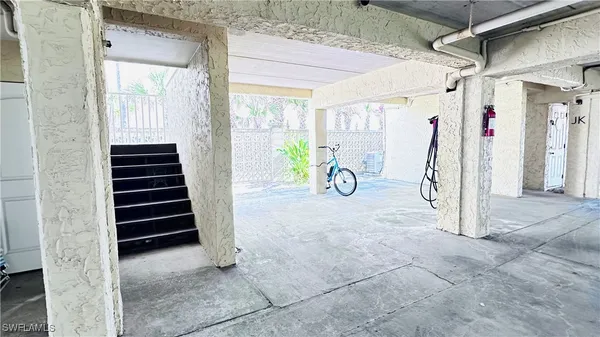 a view of a hallway with stairs