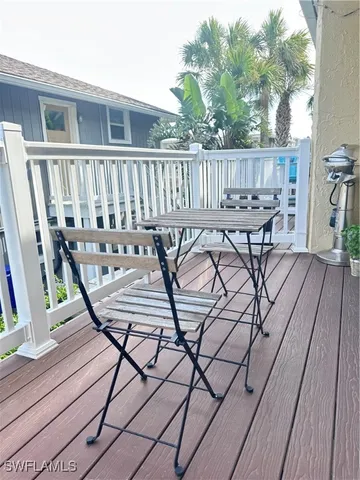 a view of a chairs and table on the wooden floor