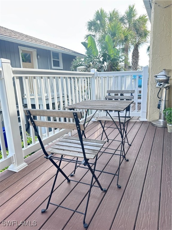1107 1st Street South, Unit H Jacksonville Beach, FL 32250 - Photo 35 of 43 a view of a chairs and table on the wooden floor
