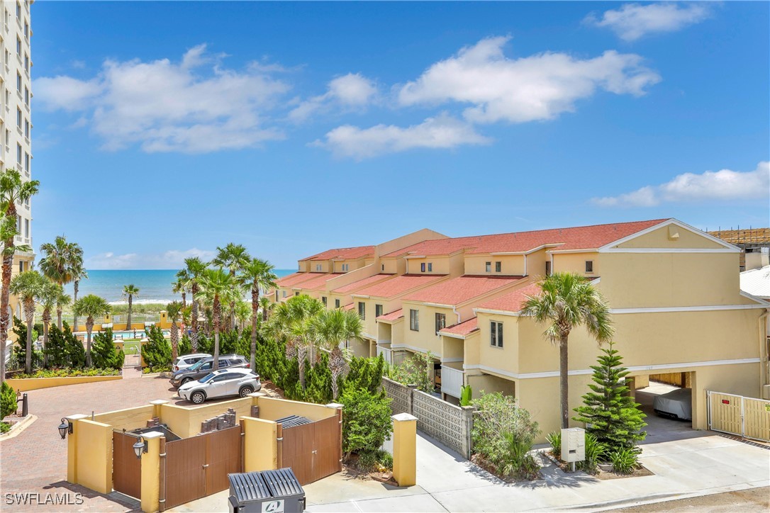 1107 1st Street South, Unit H Jacksonville Beach, FL 32250 - Photo 41 of 43 a view of a patio with couches and table and chairs and potted plants