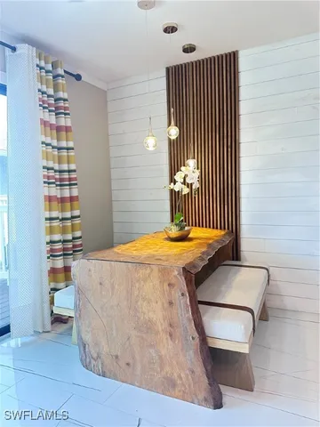 a bedroom with a bed and a book shelf